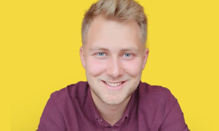 Civil Engineering apprentice Sam, 23, smiles for the camera 